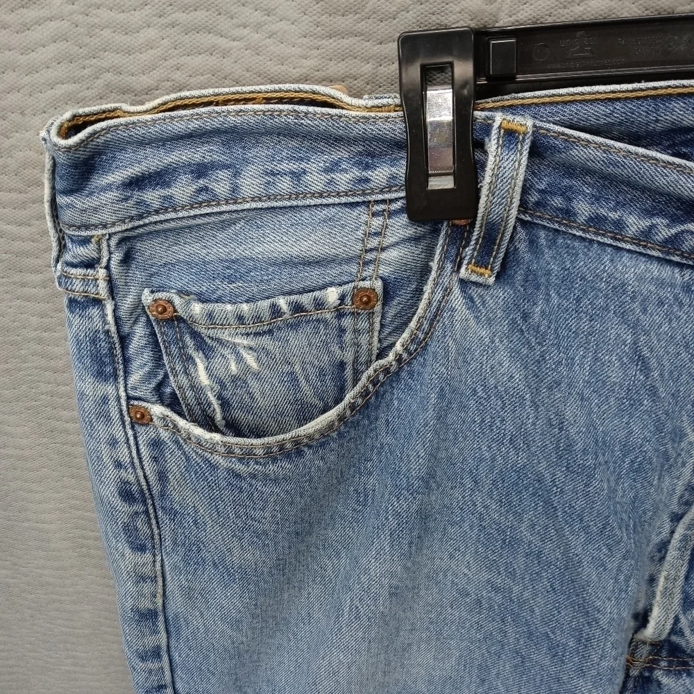 Levis 501XX men's button fly blue jeans. Sz 38x34.tear in seat. See last pic. M2